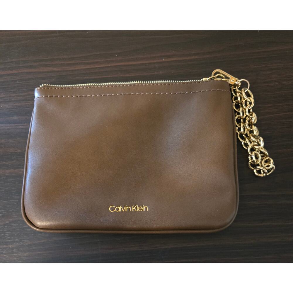 Calvin Klein faux leather wristlet clutch in brown with a detachable gold chain.